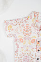 Organic cotton co-ord set with boteh print in earthy red, orange and yellow tones, collared shirt and matching shorts.