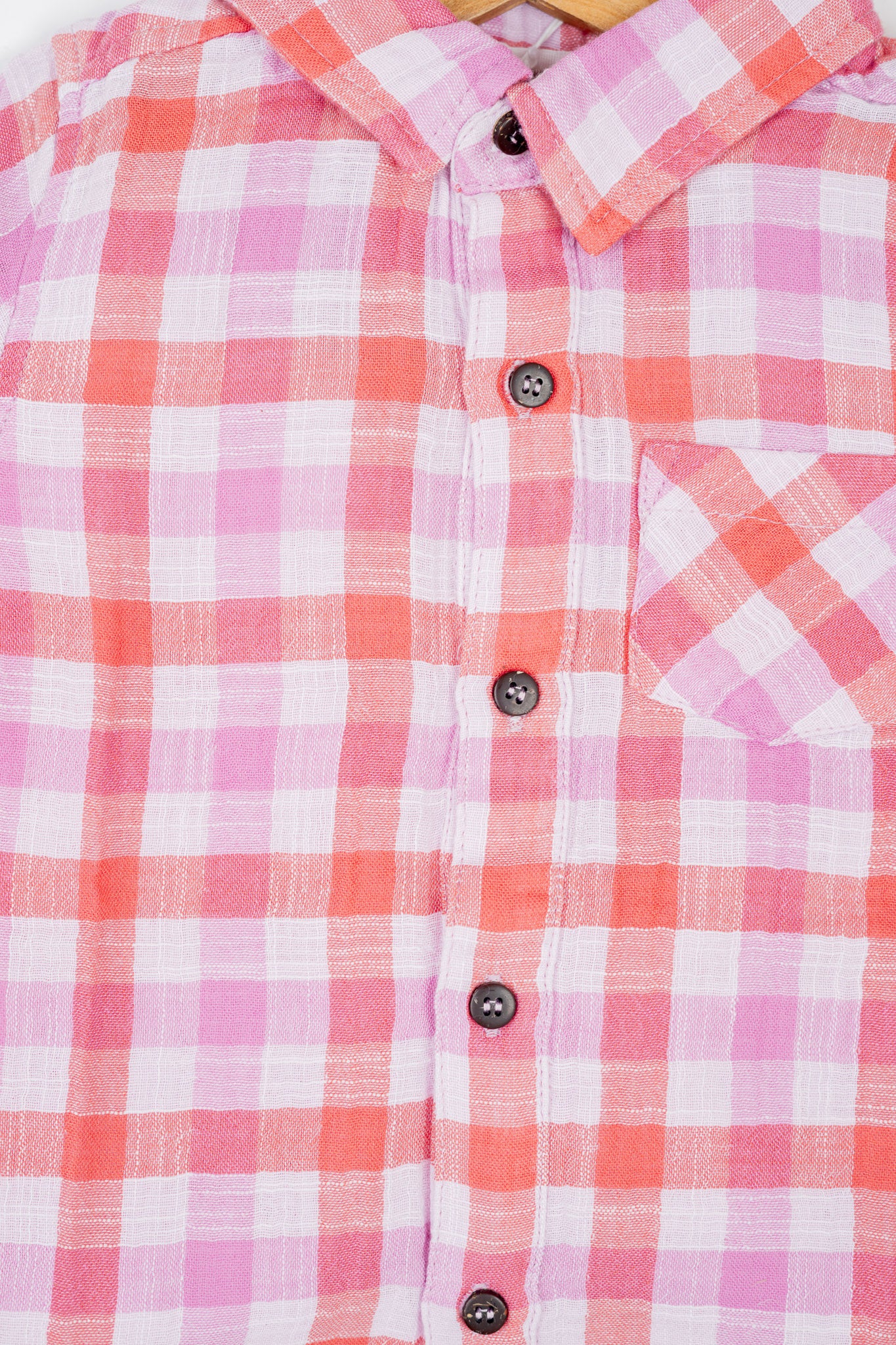 Boy's button-down double muslin organic cotton shirt, featuring deep red and purple checks and a classic collar.