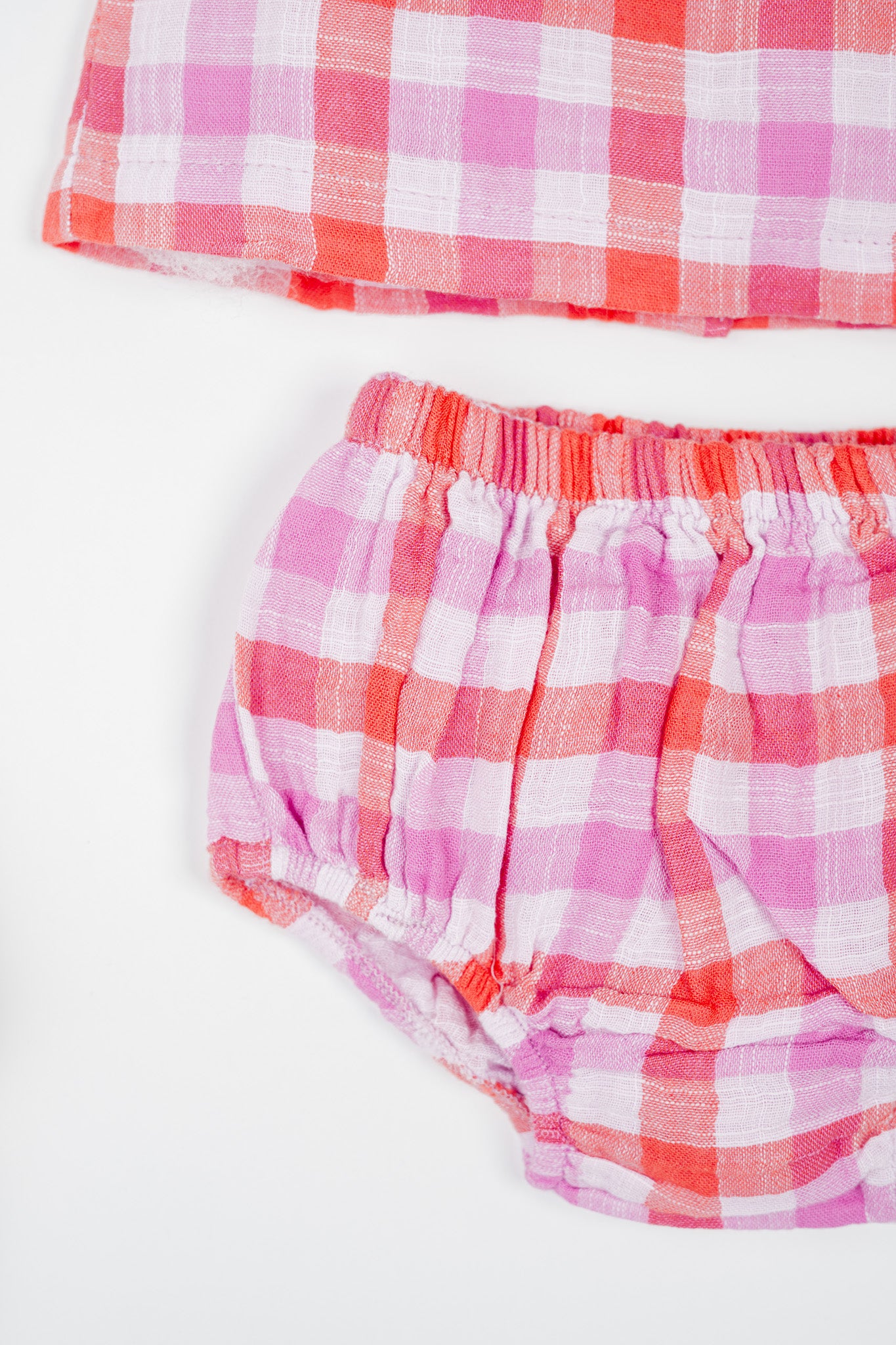 Soft, breathable, organic cotton deep red and muted purple checked infant sleeveless jhabla set with bloomer- for everyday use.