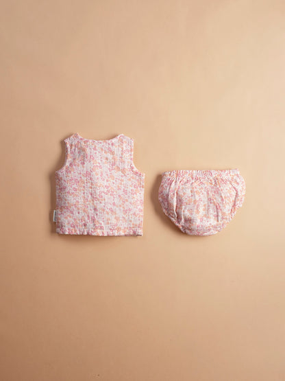 Soft muslin infant jhabla sei in cherry blossom print with matching bloomers-breathable and gentle for newborn skin.