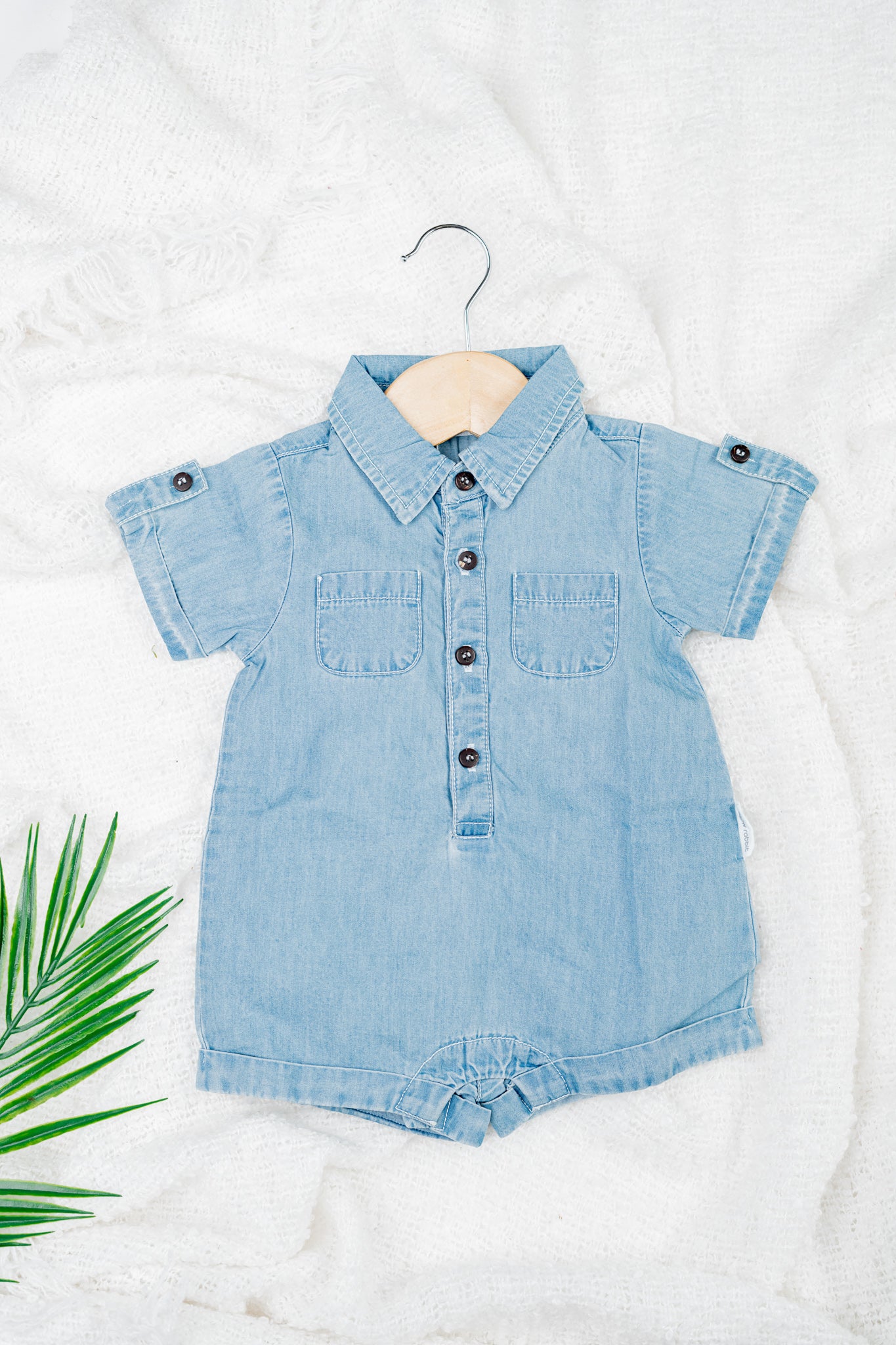 Classic blue denim overalls for babies and toddlers, made from soft organic cotton with front pockets, snap buttons for easy diaper changes.