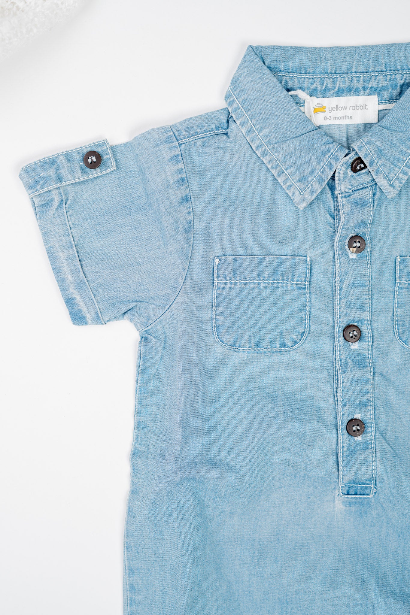 Classic blue denim overalls for babies and toddlers, made from soft organic cotton with front pockets, snap buttons for easy diaper changes.