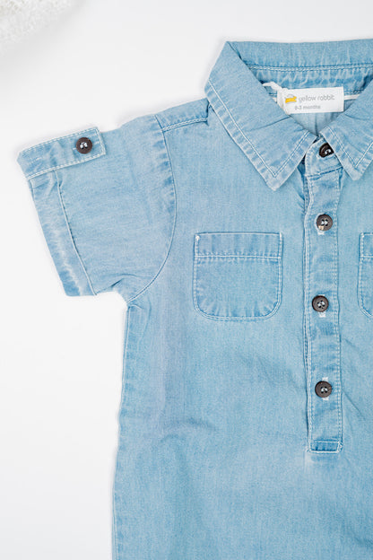 Classic blue denim overalls for babies and toddlers, made from soft organic cotton with front pockets, snap buttons for easy diaper changes.