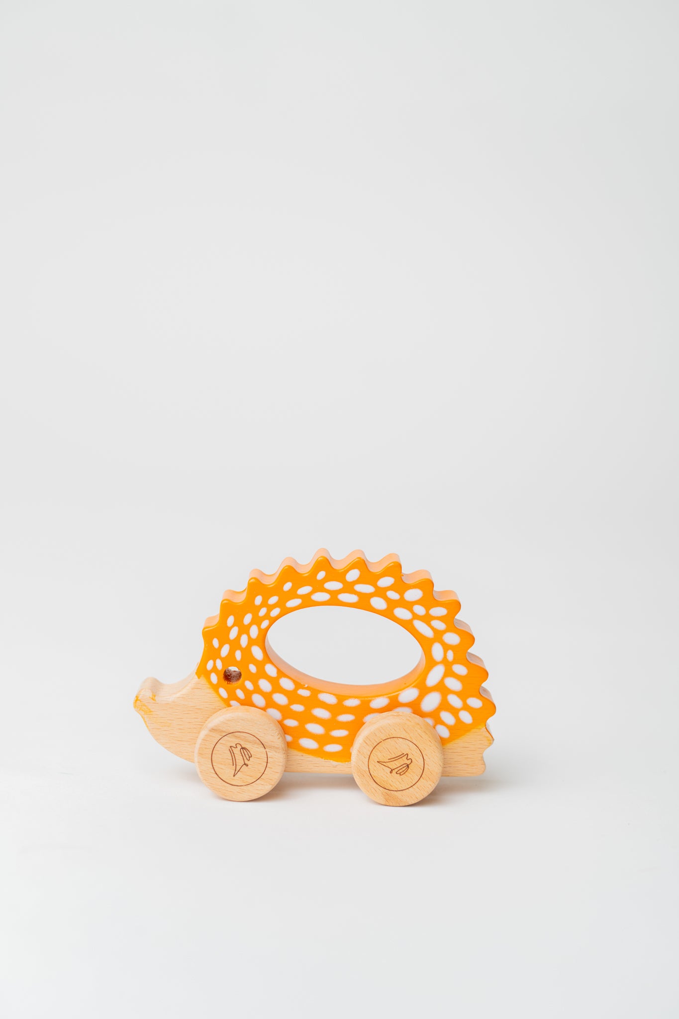 Cute wooden hedgehog toy with wheels, ideal for toddler play.