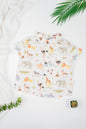 Kid's button-down shirt in organic cotton, featuring a collared neckline and watercolor safari animal print for a playful nature-inspired look.