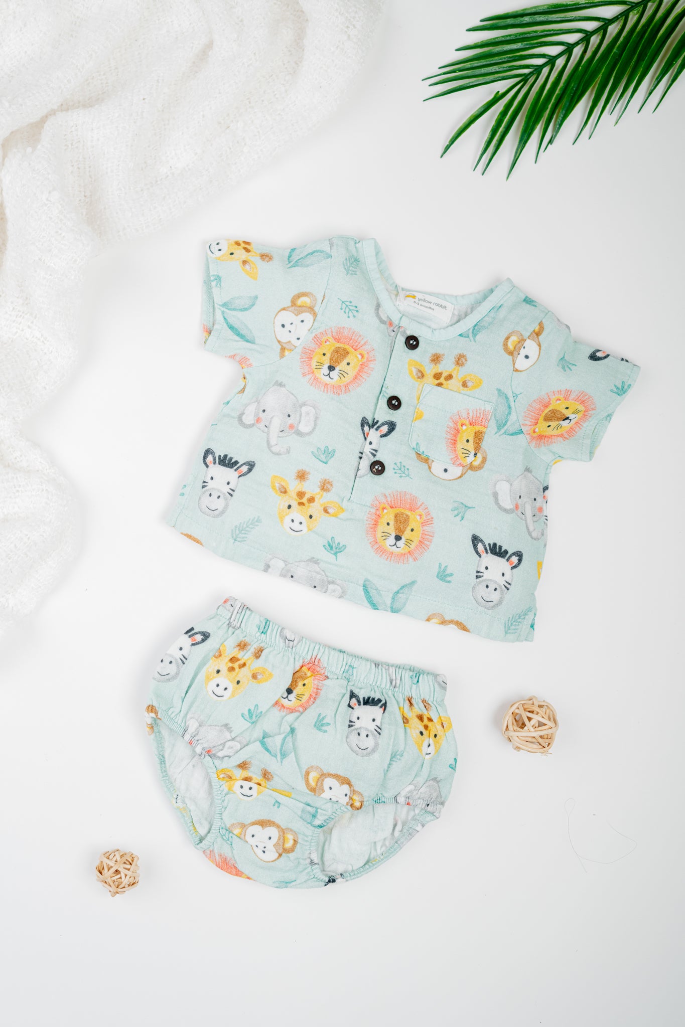 Organic cotton infant jhabla set with sleeves in animal print, paired with matching bloomers- breathable and gentle for newborns and babies.