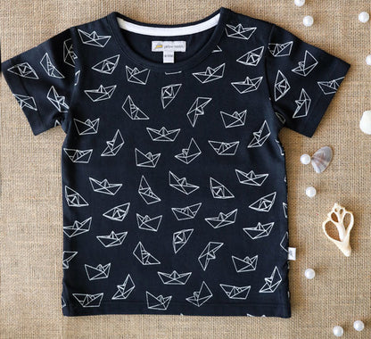 Navy blue organic cotton t-shirt with white paper boat print for kids.