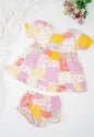 Girl's cotton patchwork printed dress with puff sleeves, featuring vibrant print, yellow and white floral and geometric prints. Comes with matching bloomers for a complete summer outfit.