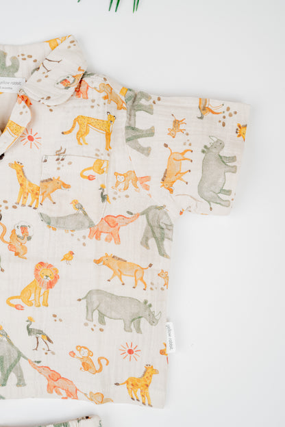 Organic cotton co-ord set with safari animals print, collared shirt and matching shorts.