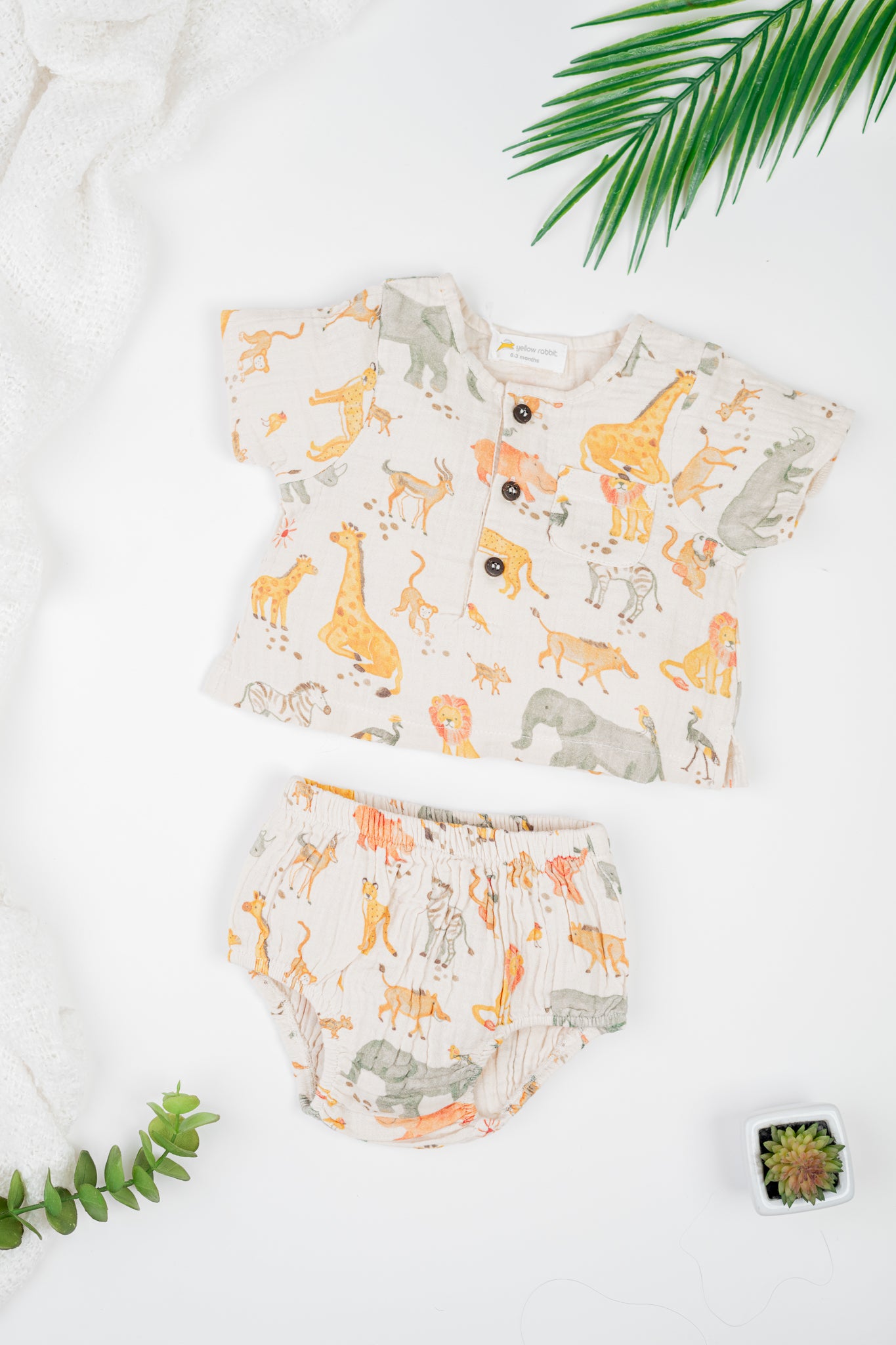 Soft organic cotton infant jhabla set with sleeves and matching diaper cover in Serengeti inspired safari print- cozy and stylish outfit for infants.