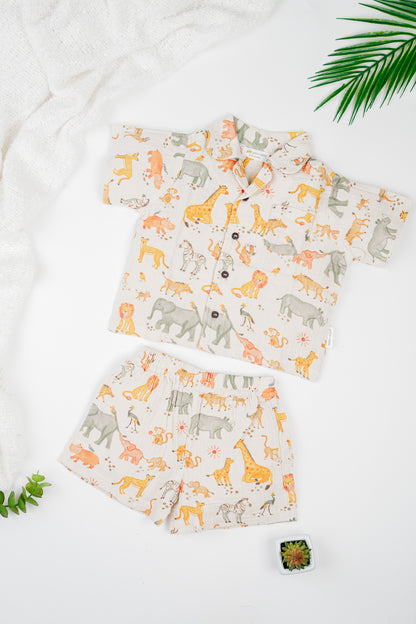 Organic cotton co-ord set with safari animals print, collared shirt and matching shorts.