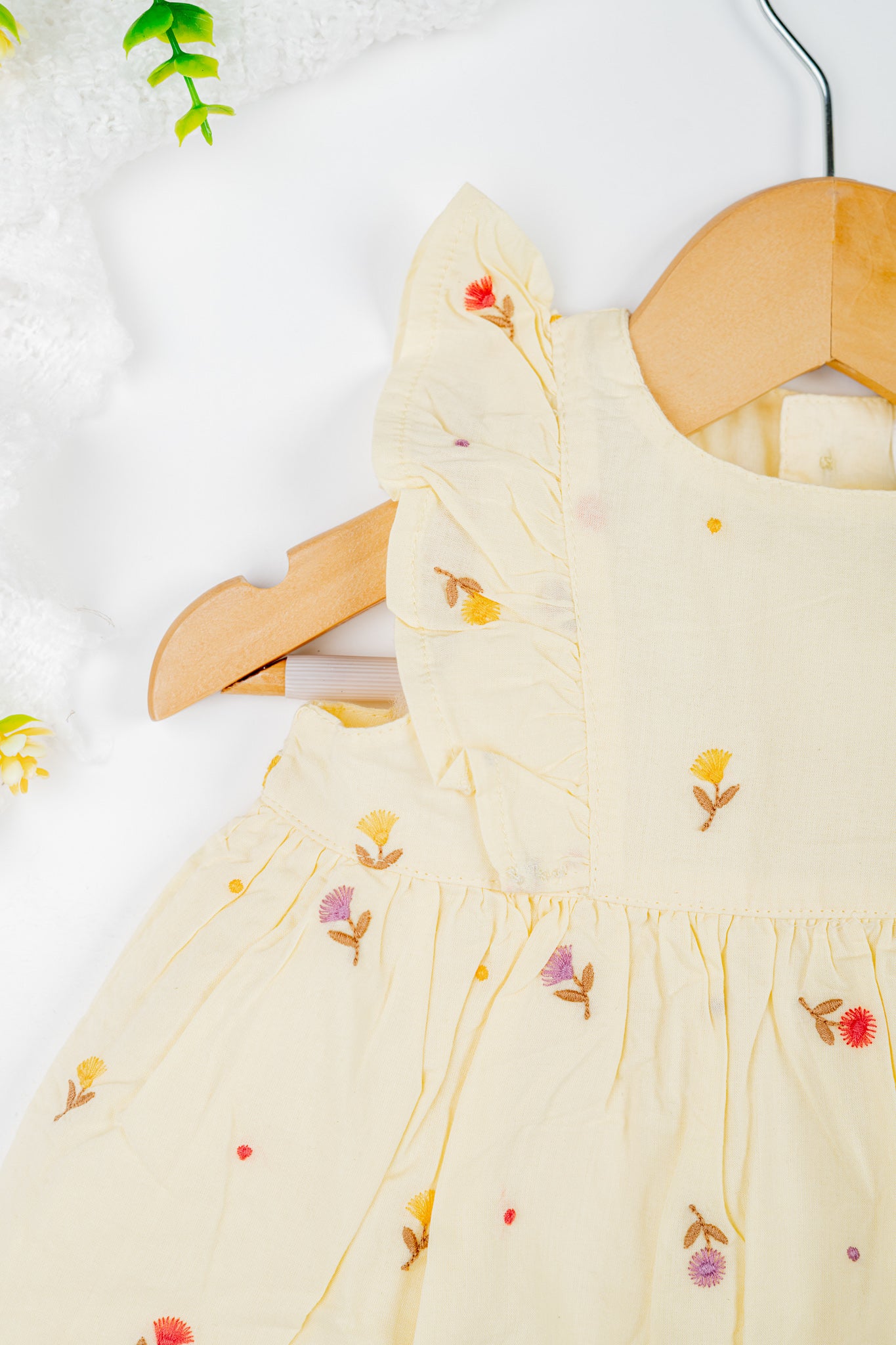 Yellow tulip embroidered baby dress with ruffled sleeves- organic cotton, lightweight and breathable.