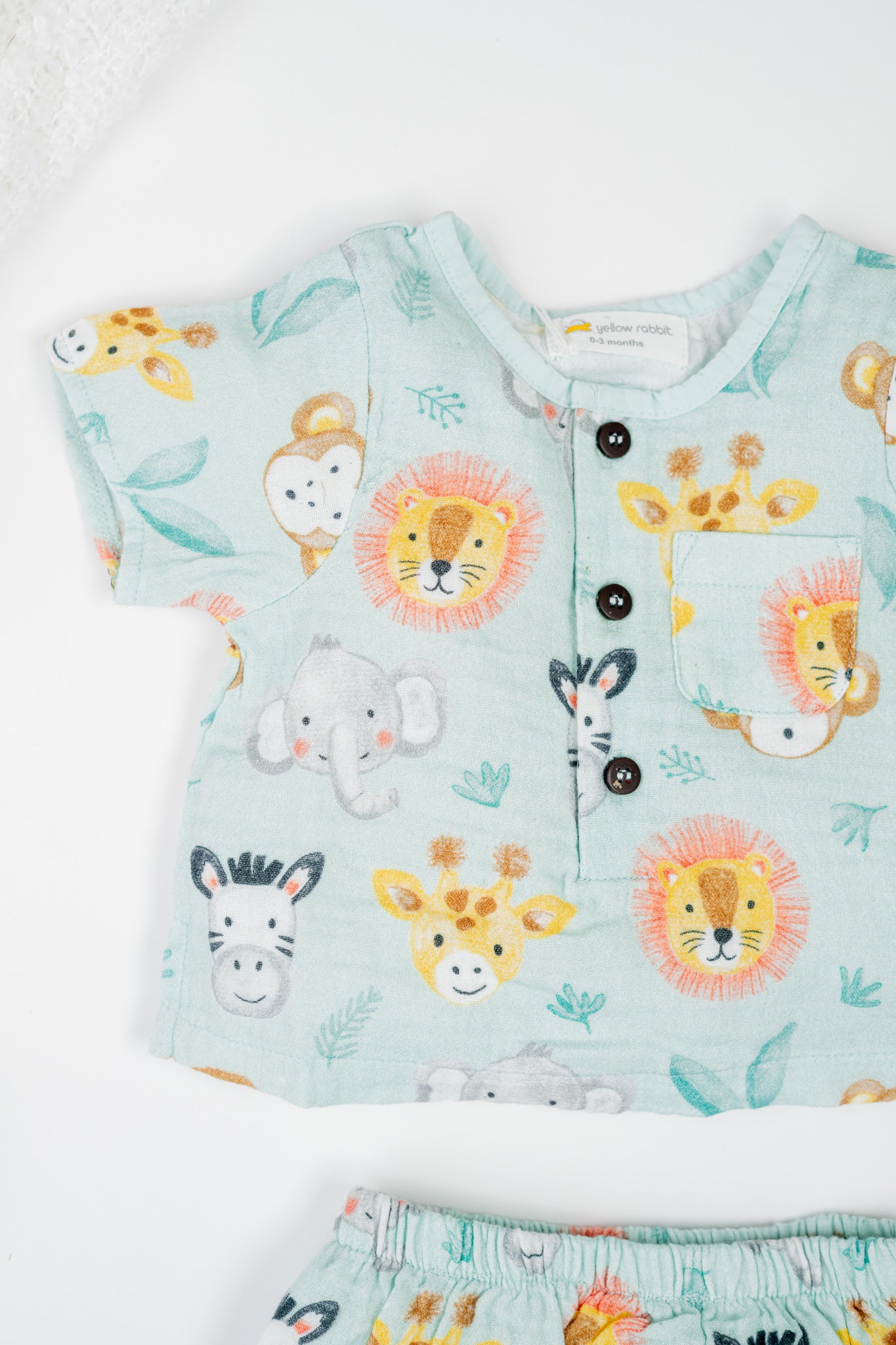 Organic cotton infant jhabla set with sleeves in animal print, paired with matching bloomers- breathable and gentle for newborns and babies.