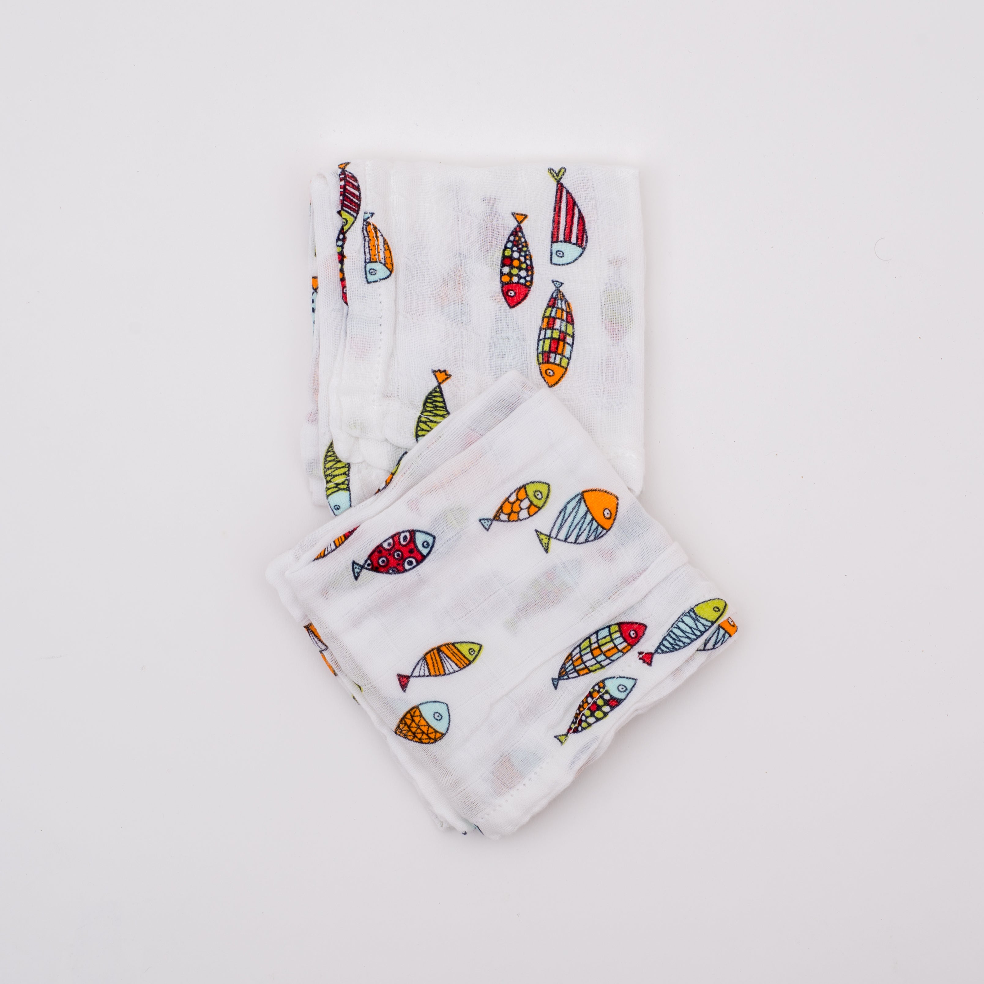Muslin squares with colourful fish print